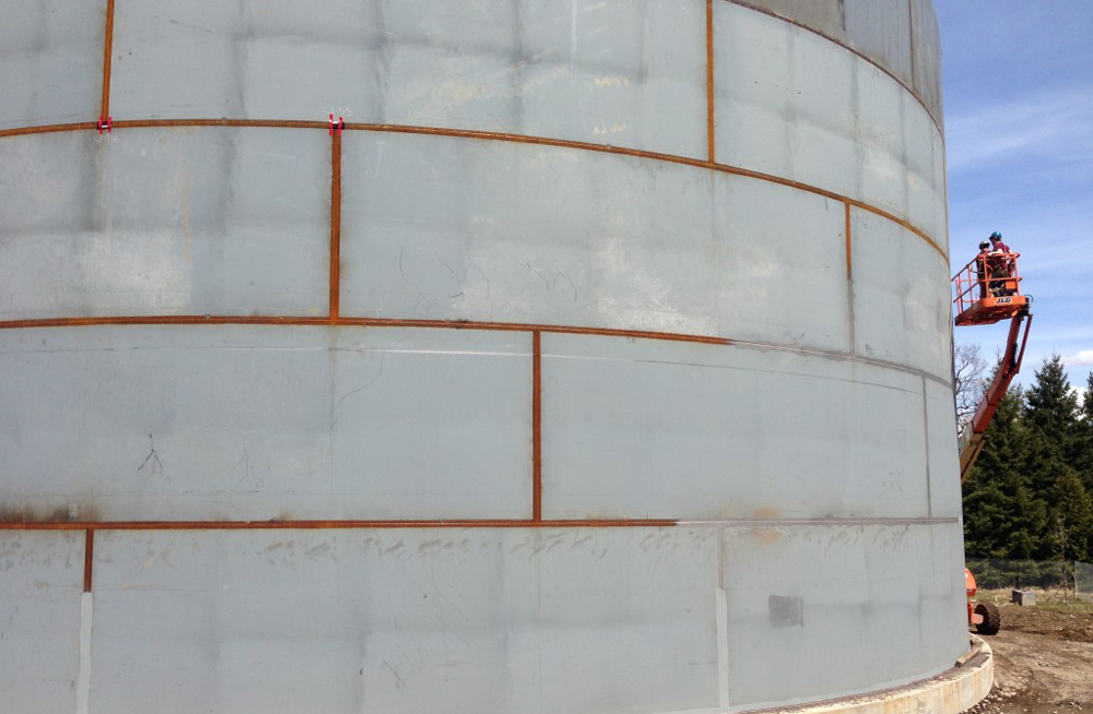 image of the exterior wall during the grouting process of a chilled water thermal energy storage tank.