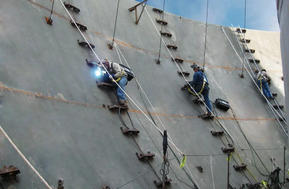image Landmark Structures workers welding in the interior of the steel tank.
