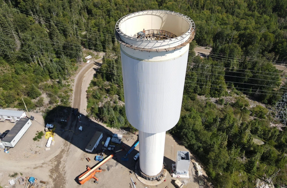 image of surge tank being hoisted.