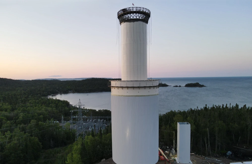 image of surge tank being hoisted.