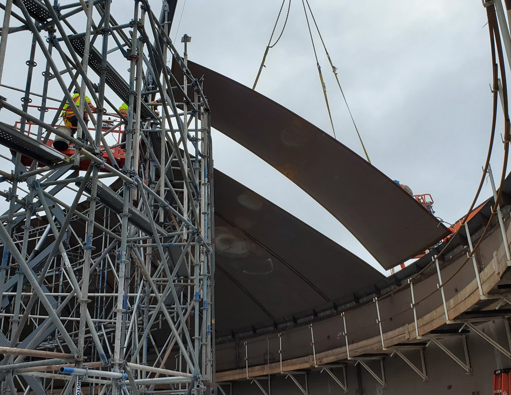 image of a water storage reservoir roof paneling being placed.