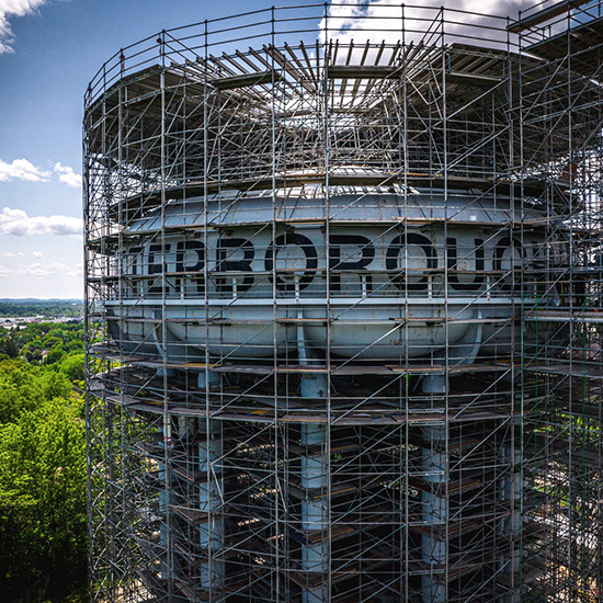 Workers cleaning water tower